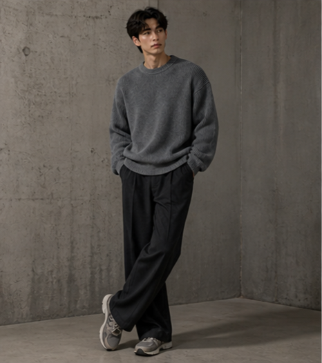 Lightweight, textured knit oversized sweater with a casual unisex style, featuring a minimalist design, relaxed loose fit, and classic crew neck