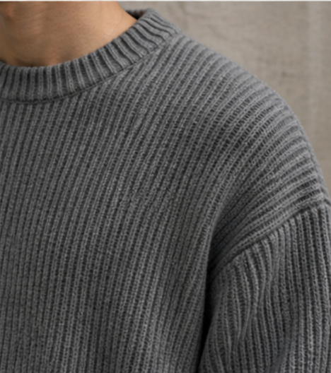 Lightweight, textured knit oversized sweater with a casual unisex style, featuring a minimalist design, relaxed loose fit, and classic crew neck