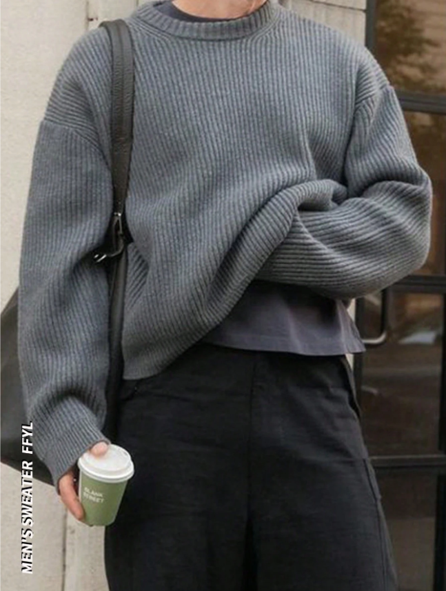 Lightweight, textured knit oversized sweater with a casual unisex style, featuring a minimalist design, relaxed loose fit, and classic crew neck