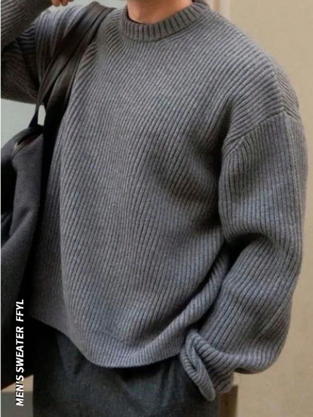 Lightweight, textured knit oversized sweater with a casual unisex style, featuring a minimalist design, relaxed loose fit, and classic crew neck