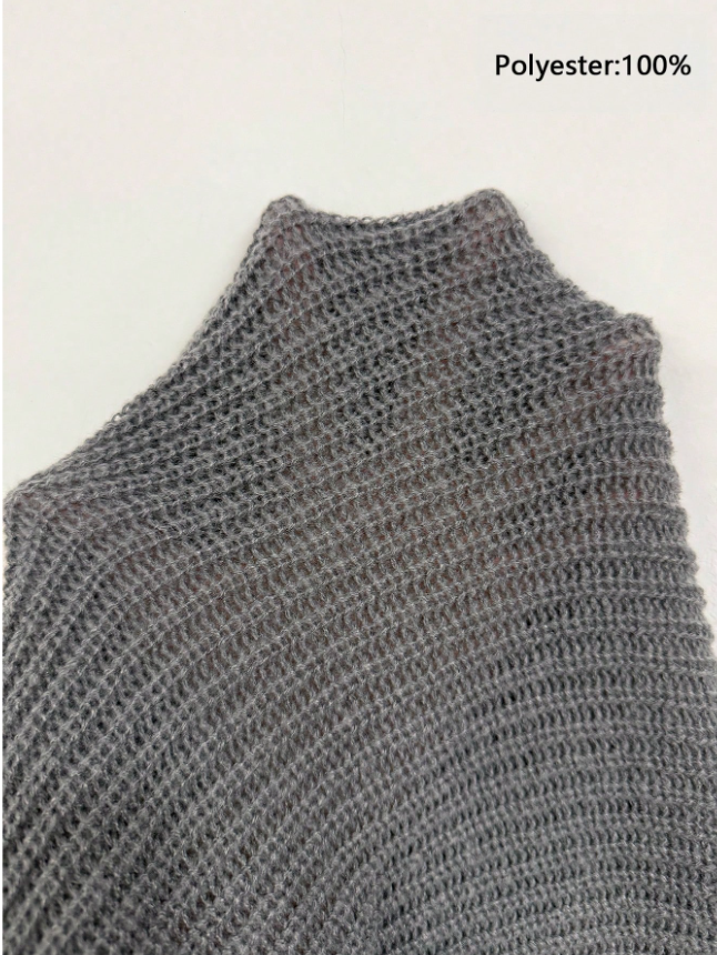 Lightweight, textured knit oversized sweater with a casual unisex style, featuring a minimalist design, relaxed loose fit, and classic crew neck