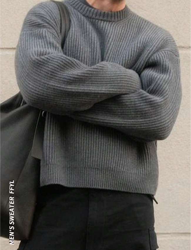 Lightweight, textured knit oversized sweater with a casual unisex style, featuring a minimalist design, relaxed loose fit, and classic crew neck
