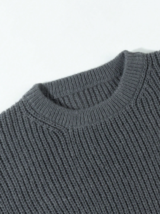 Lightweight, textured knit oversized sweater with a casual unisex style, featuring a minimalist design, relaxed loose fit, and classic crew neck