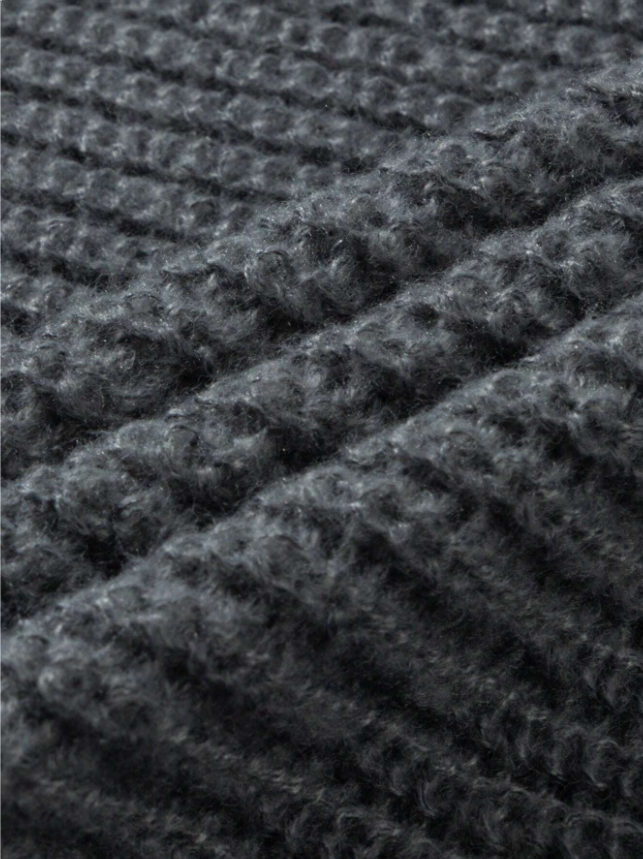 Lightweight, textured knit oversized sweater with a casual unisex style, featuring a minimalist design, relaxed loose fit, and classic crew neck